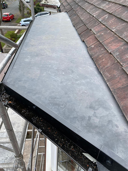 Flat roof on a bay window nicely repaired with RubberCover