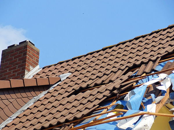 Storm damage to a roof needing repair